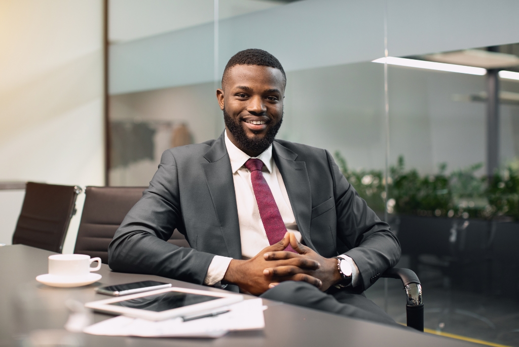 Man sitting at desk during his interim leadership at his temporary role