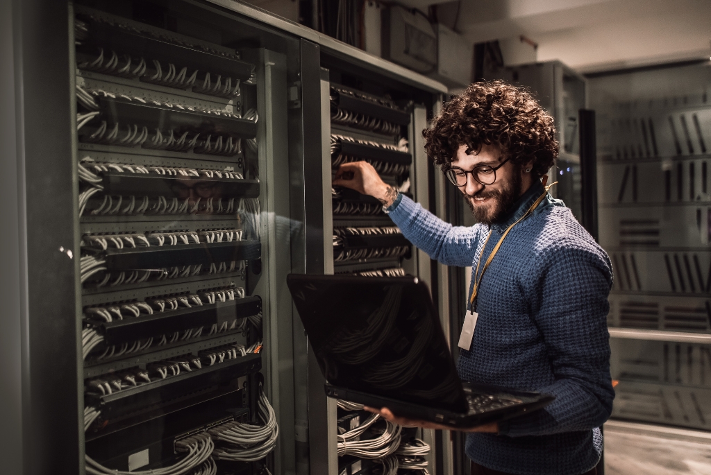 Man working on a server for IT contract jobs